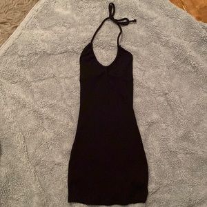 Fitted black dress with a tied string that goes around the neck for straps!